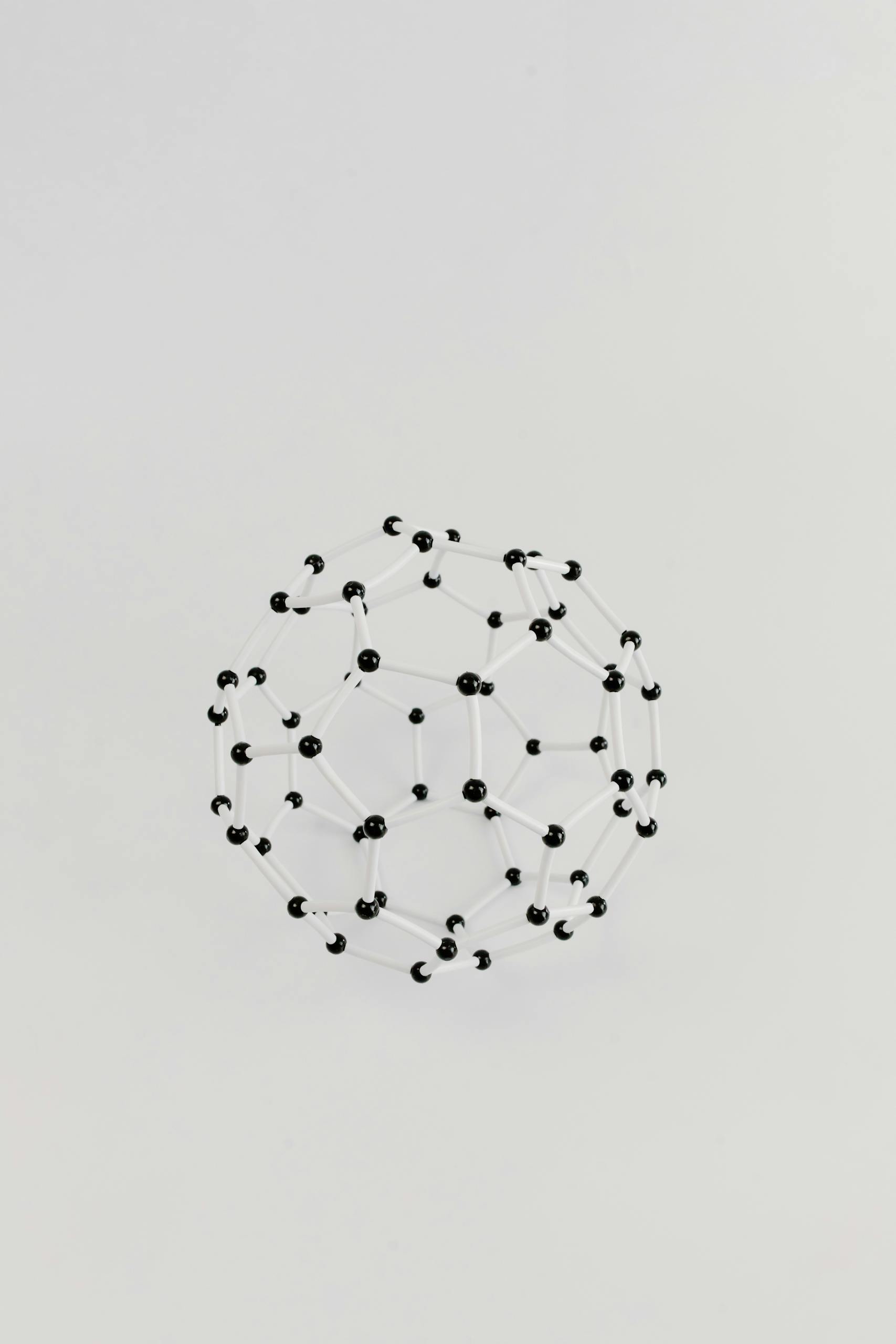 Abstract representation of a molecular structure in a geometric model on a plain white background.